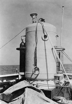 A diving bell rests on the deck of the USS Falcon as the effort to raise the USS Squalus gets underway.