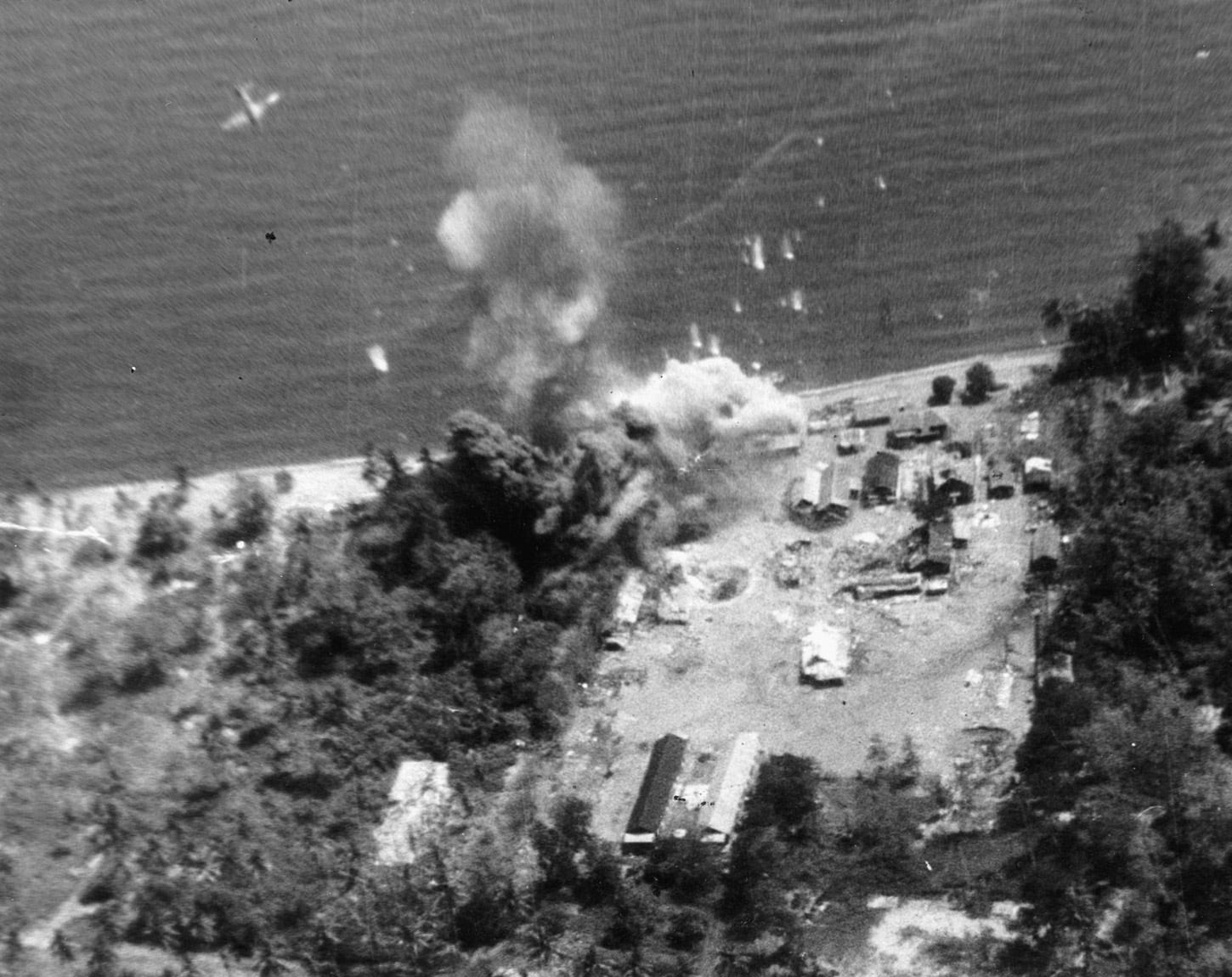 A U.S. Marine Corps dive-bomber scores a direct hit on a Japanese oil tanker near Rabaul in July of 1944. A U.S. Marine Corps dive-bomber scores a direct hit on a Japanese oil tanker near Rabaul in July of 1944.