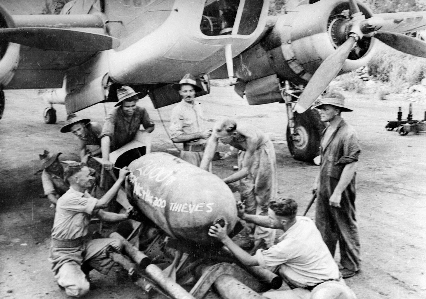 Members of an RAAF squadron leave their mark on a 2000-pound “daisy cutter” to be dropped on the Lakunai Aerodome in Rabaul. Members of an RAAF squadron leave their mark on a 2000-pound “daisy cutter” to be dropped on the Lakunai Aerodome in Rabaul.